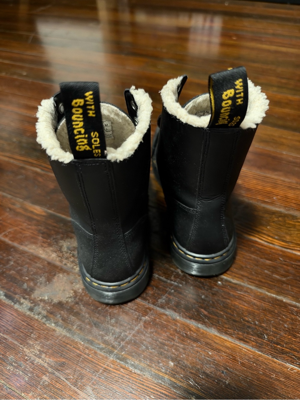 Dr. Martens Black Leather Shearling-Trim Boots with Yellow Pull Tabs